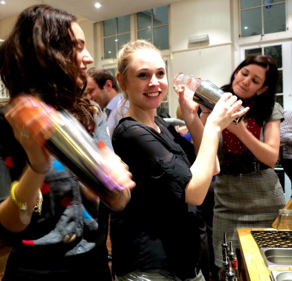 The girls mixing up a cocktail together